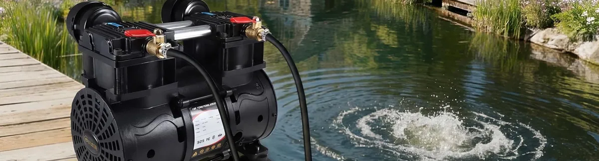 The Goldlife A3 air compressor on a dock beside a pond, with a boil of bubbles on the surface