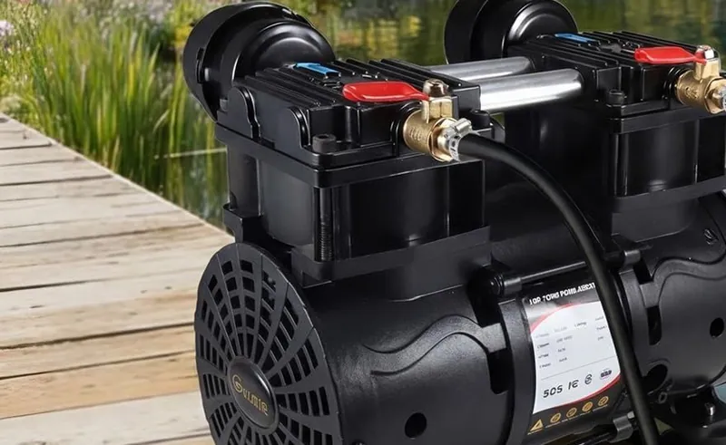 The Goldlife A3 twin-cylinder air compressor on a wooden dock