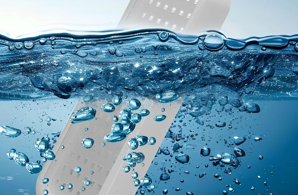 A Goldlife B5 boat light breaking through the surface of the water