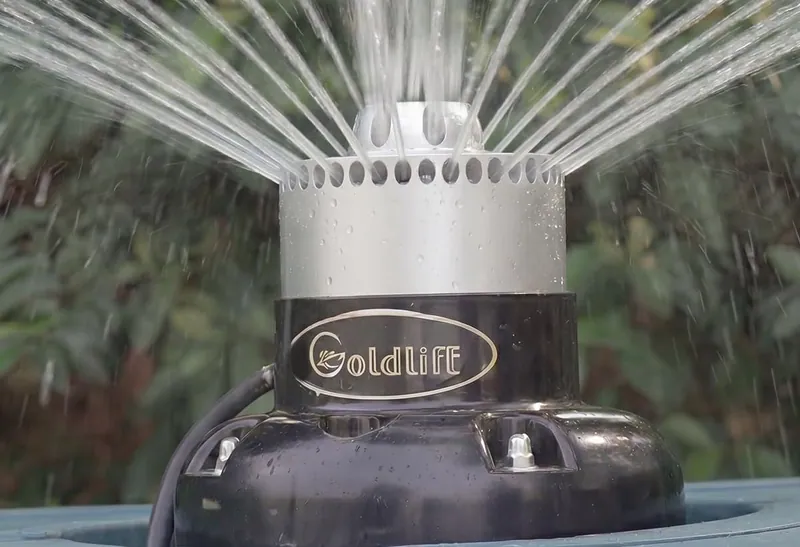 A Goldlife aluminium nozzle spraying a ring of thin jets, seen up close